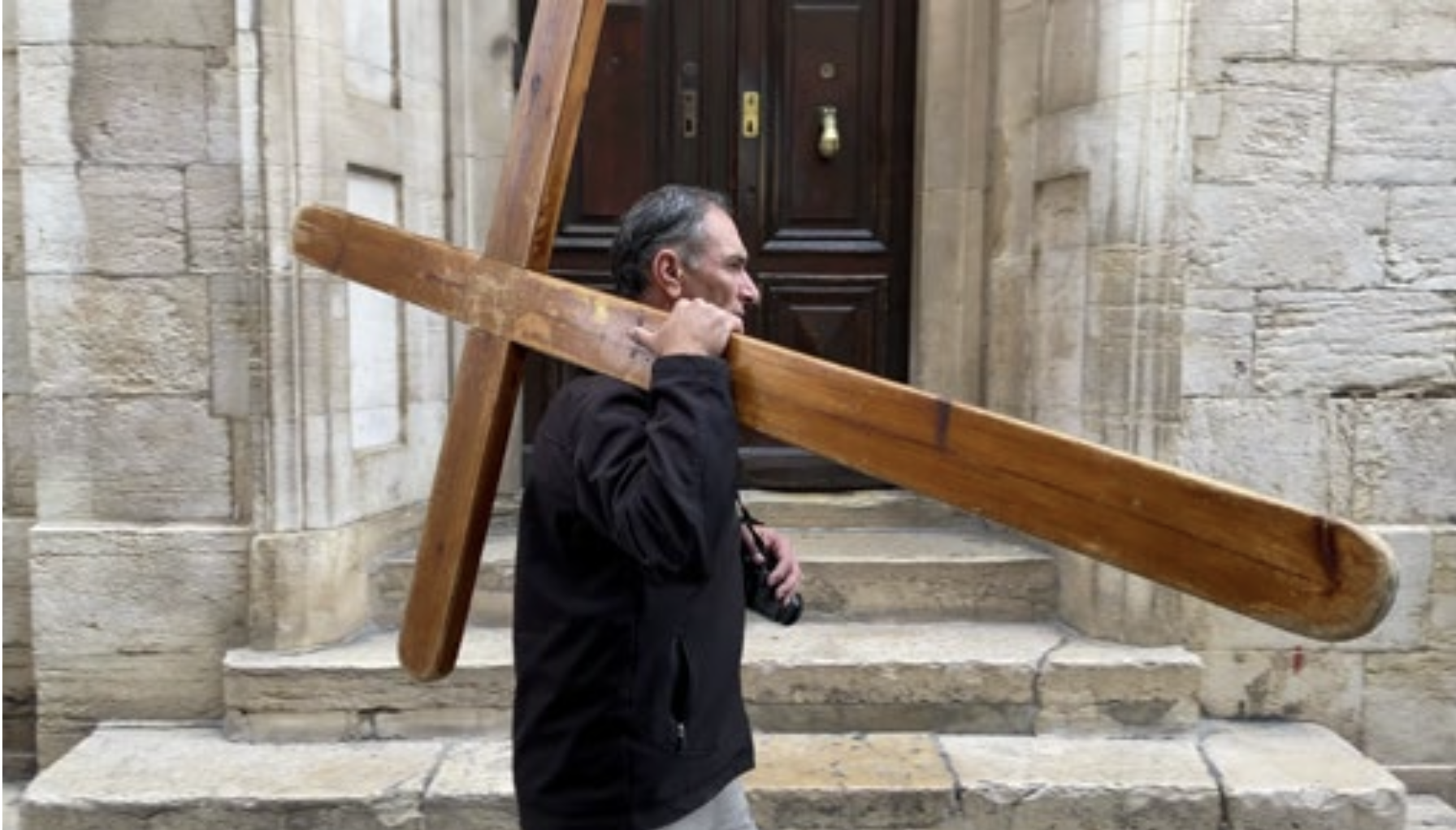 There’s Somebody Carrying a Cross Down